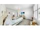Primary bedroom with a four poster bed, ensuite bathroom, and shuttered windows at 13749 Hunting Creek Pl, Spring Hill, FL 34609