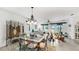 The dining room has a chandelier and has sliding door access to outside at 13749 Hunting Creek Pl, Spring Hill, FL 34609