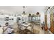 The dining room has an ornate chandelier and glass display cabinets at 13749 Hunting Creek Pl, Spring Hill, FL 34609