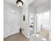 Bright entryway featuring tile floors and views into the living room and bathroom at 13749 Hunting Creek Pl, Spring Hill, FL 34609