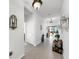 Bright hallway features art niches, statues, and tile flooring leading to the living area at 13749 Hunting Creek Pl, Spring Hill, FL 34609