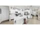 Bright kitchen features stainless steel appliances, white cabinetry, and central island at 13749 Hunting Creek Pl, Spring Hill, FL 34609