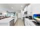 Modern kitchen with a large island, stainless steel appliances, and ample counter space at 13749 Hunting Creek Pl, Spring Hill, FL 34609