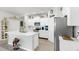 Bright kitchen featuring white cabinets, stainless steel appliances, and a kitchen island at 13749 Hunting Creek Pl, Spring Hill, FL 34609