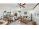 Elegant living room features tile floors, ceiling fan and comfortable seating at 13749 Hunting Creek Pl, Spring Hill, FL 34609