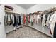 Spacious walk-in closet with organized shelving and hanging rods for maximum storage at 13749 Hunting Creek Pl, Spring Hill, FL 34609
