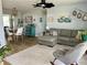 Open concept living room and dining area with modern decor and comfortable seating at 14019 89Th Ave, Seminole, FL 33776