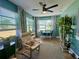 Bright sunroom with lots of windows, a sitting area, and space for dining at 14019 89Th Ave, Seminole, FL 33776