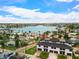 Stunning aerial view of property near waterfront featuring lush landscaping and community pool at 187 145Th E Ave # 4, St Petersburg, FL 33708