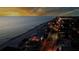 Night aerial view of the beach property with amazing coastal views and bright city lights at 187 145Th E Ave # 4, St Petersburg, FL 33708