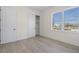 Bright bedroom with ample closet space, a large window and neutral color scheme at 187 145Th E Ave # 4, St Petersburg, FL 33708