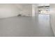 Large, clean garage features epoxy floors and storage space at 187 145Th E Ave # 4, St Petersburg, FL 33708