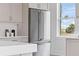 Modern kitchen features stainless steel Viking refrigerator and bright window view at 187 145Th E Ave # 4, St Petersburg, FL 33708