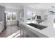 Bright, open kitchen featuring an island sink, stainless steel appliances, and modern cabinetry at 187 145Th E Ave # 4, St Petersburg, FL 33708