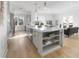 Bright kitchen featuring stainless steel appliances, quartz countertops, and modern gray cabinetry at 187 145Th E Ave # 4, St Petersburg, FL 33708