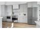 Modern kitchen with stainless steel appliances, quartz countertops, and updated cabinetry at 187 145Th E Ave # 4, St Petersburg, FL 33708