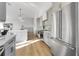 Open concept kitchen featuring stainless steel appliances and a large island at 187 145Th E Ave # 4, St Petersburg, FL 33708