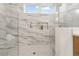 Modern walk-in shower with stylish tile work, and convenient inset shelving at 187 145Th E Ave # 4, St Petersburg, FL 33708