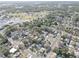 Aerial view showcasing the neighborhood with mature trees and nearby amenities at 2009 E Eskimo Ave, Tampa, FL 33604