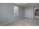 This bedroom has a closet, tile flooring, and a bright window at 2009 E Eskimo Ave, Tampa, FL 33604