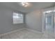 This quaint bedroom has tile flooring and a view into an adjacent hallway at 2009 E Eskimo Ave, Tampa, FL 33604
