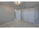This room features sliding door closets and tile flooring at 2009 E Eskimo Ave, Tampa, FL 33604