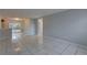 Open-concept living space with tile floors and access to the backyard at 2009 E Eskimo Ave, Tampa, FL 33604