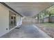 View of the covered patio and adjacent yard at 2009 E Eskimo Ave, Tampa, FL 33604