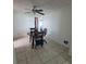 Casual dining area with tiled floor and a view into other rooms of the house at 2110 Society Dr, Holiday, FL 34691
