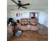 Inviting living room featuring laminate floors and comfy couches at 2110 Society Dr, Holiday, FL 34691