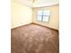 Bedroom with standard closet, carpet floor, ceiling fan, and large window at 2302 Maki Rd # 24, Plant City, FL 33563