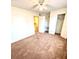 Bedroom with standard closet, carpet floor, ceiling fan, and desk nook at 2302 Maki Rd # 24, Plant City, FL 33563
