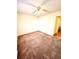 Standard bedroom with a carpet floor, a ceiling fan, and a standard window at 2302 Maki Rd # 24, Plant City, FL 33563