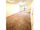 Comfortable bedroom with neutral carpeting and a window for natural light at 2302 Maki Rd # 24, Plant City, FL 33563
