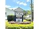 Kentwood Park community sign surrounded by lush greenery on a sunny day at 2302 Maki Rd # 24, Plant City, FL 33563