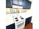 Well-lit kitchen featuring blue cabinets, white countertops, and modern appliances at 2302 Maki Rd # 24, Plant City, FL 33563