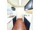 Efficient kitchen with blue cabinets, white appliances, and modern countertops at 2302 Maki Rd # 24, Plant City, FL 33563