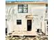 Back of home with patio and black door and air conditioning unit at 2302 Maki Rd # 24, Plant City, FL 33563