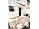 Back of home with patio, awning and black door and air conditioning unit at 2302 Maki Rd # 24, Plant City, FL 33563
