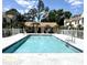Inviting community pool surrounded by well-maintained landscaping and buildings at 2302 Maki Rd # 24, Plant City, FL 33563