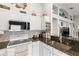 Modern kitchen with white cabinetry, granite countertops, stainless steel appliances, and stylish backsplash at 23734 Coral Ridge Ln, Land O Lakes, FL 34639