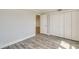 A bedroom with a closet and a view to another room with hard surface floors, light gray walls at 2618 Cove Cay Dr # 801, Clearwater, FL 33760