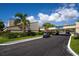 Exterior shot of the community golf club with golf carts and lush landscaping at 2618 Cove Cay Dr # 801, Clearwater, FL 33760