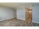 Hallway with hard surface floors, light gray walls, and bathroom with tile accents at 2618 Cove Cay Dr # 801, Clearwater, FL 33760