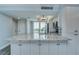 Bright kitchen with a large island, granite countertops, and stainless steel appliances at 2618 Cove Cay Dr # 801, Clearwater, FL 33760