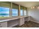 Water view from window, complemented by a built-in desk, cabinets, and hard surface flooring at 2618 Cove Cay Dr # 801, Clearwater, FL 33760