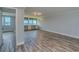View of the living room with light gray walls, hard surface floors, and windows with scenic water views at 2618 Cove Cay Dr # 801, Clearwater, FL 33760