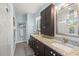 Bright bathroom features a double vanity, granite countertops, and a glass-enclosed shower at 2623 57Th S St, Gulfport, FL 33707