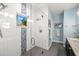 Modern bathroom with a glass-enclosed shower, sleek fixtures, and neutral tones at 2623 57Th S St, Gulfport, FL 33707