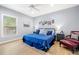 Cozy bedroom featuring wood floors, neutral tones, and ample natural light at 2623 57Th S St, Gulfport, FL 33707